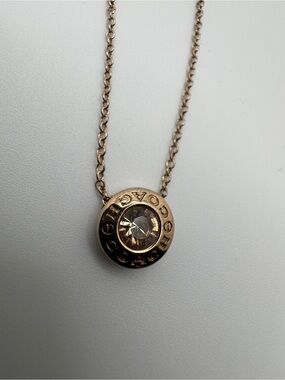 Coach Rose Gold-toned Open Circle Rose-Amber Crystal Round Logo Pendant Necklace